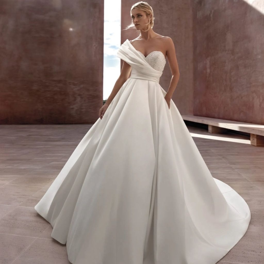 30 Elegant Wedding Dresses for Brides Who Love Quiet Luxury 5 Luxury Bridal Designers