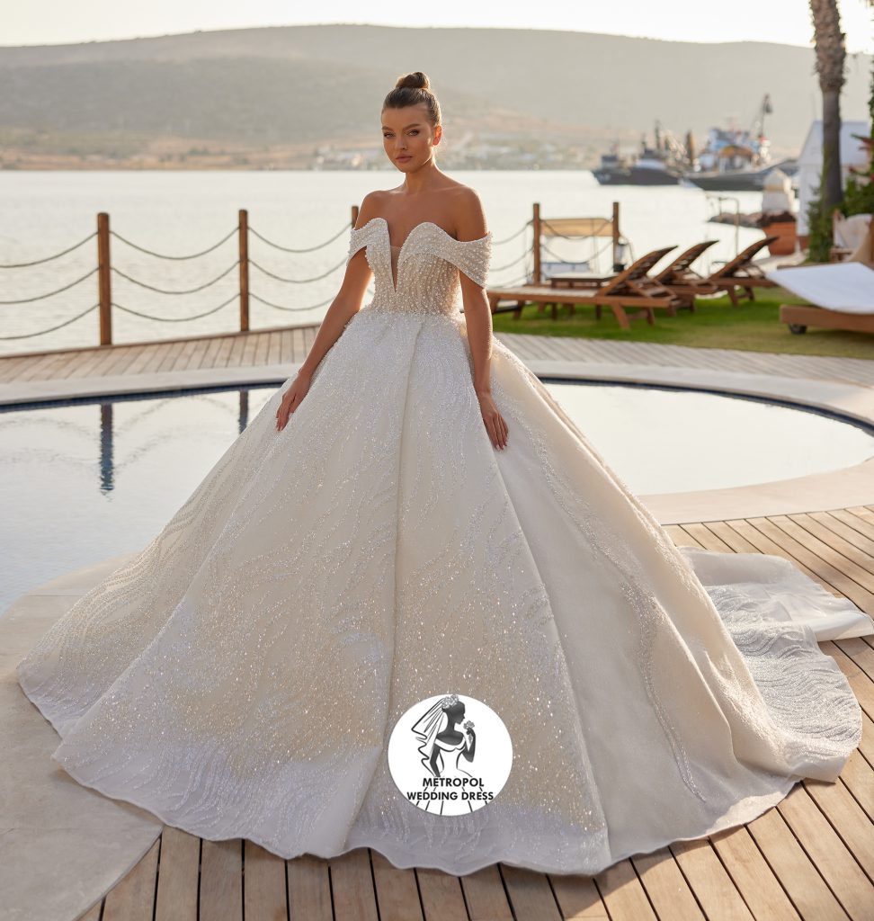 30 Elegant Wedding Dresses for Brides Who Love Quiet Luxury 3 The Off the Shoulder Minimalist Dress